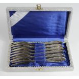 German cased pastry fork set, reverse of handle engraved 'SS-Reich'. Maker marked 'Becker 90'. (6)