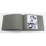 James Bond 007 film photographs housed in album, modern reprints. (approx 39)