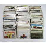 Plastic crate packed with a very general mix of postcards. (100's)