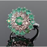 18ct white gold three tier emerald and diamond cluster ring consisting of central round emerald