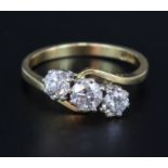 18ct yellow and white gold graduated diamond crossover design ring comprising three round