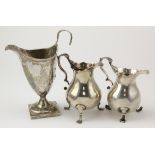 Three George III silver milk jugs, one with weighted base & damaged handle, tallest 14cm approx.,