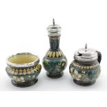 Doulton Pottery. Lambeth Faience three piece cruet set with silver rims, the silver is marked