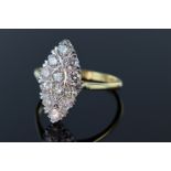 18ct and platinum marquise shaped diamond ring consisting of twelve round brilliant cut diamonds