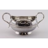 Omar Ramsden (1873-1939), silver twin-handled loving cup, hallmarked London 1937, hammered finish