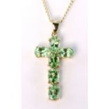 9ct yellow gold cross pendant set with six 6mm x 4mm oval peridot stones, on a9ct yellow gold 50cm