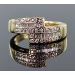 18ct yellow gold band ring set with two sections of channel set baguette cut diamonds surrounded