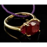 Yellow metal ring (stamped 9K), with a red stone, finger size S, total weight 4.6g approx.