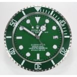 Advertising Wall Clock. Green & chrome 'Rolex' advertising wall clock, black dial reads 'Rolex