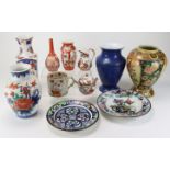 Oriental interest. A collection of eleven mostly Oriental ceramics & porcelain, including vases,