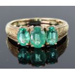 9ct yellow gold ring set with three graduated oval Columbian emeralds totalling 1.294ct, with