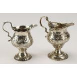 Two George III silver ornately decorated milk jugs, hallmarked 'WK, London 1770' & 'GS, London