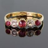 18ct yellow gold graduated five stone ruby and diamond ring with rub over setting, total diamond