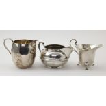 Three George V silver milk jugs, hallmarked London 1919, 1923 & 1933, tallest 7.5cm approx.,