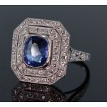 Platinum sapphire and diamond octagonal shaped cluster ring set with central oval blue sapphire