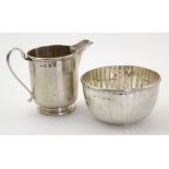 Silver sugar bowl & milk jug, hallmarked 'W&H, Sheffield 1927 / 1928', some dents, jug height 9cm