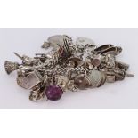 Silver / white metal charm bracelet with a good selection of charms attached. Total weight approx