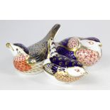 Birds. A group of three Royal Crown Derby Paperweights with silver stoppers.