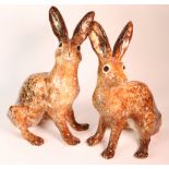 Pair of Winstanley Hares. Hand made and painted with cathedral glass eyes.Both size 6. Signed.
