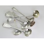 Seven George III silver condiment spoons, all with monogram, initials or armorial to handles,