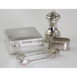 Mixed lot of silver items (4) comprising a small cigarette box, sugar tongs, napkin ring and