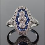 Platinum diamond and sapphire Art Deco style oval ring set with a central panel of three graduated