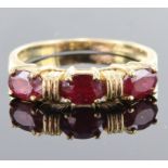 9ct yellow gold ring set with three 6mm x 4mm oval rubies totalling 1.26ct, finger size N, weight