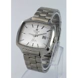 Gents Tissot "Seven" automatic wristwatch. The oblong silver dial with silvered baton markers and