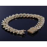 New 9ct yellow gold solid curb link chain bracelet measuring 24cm long and 1.4cm wide, with a box