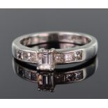 Platinum ring set with central step cut diamond calculated as weighing approx. 0.25ct, with a