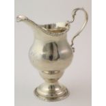 George III silver milk jug, hallmarked 'E.C (possibly Elizabeth Cooke) London 1775', height 13cm