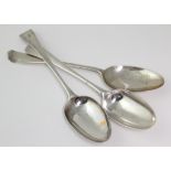Three George III silver Hanoverian / old English pattern table spoons, one with initial to handle,