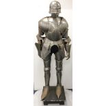 Suit of Armour. A fine steel suit of armour in the Gothic style made by Terry English to original