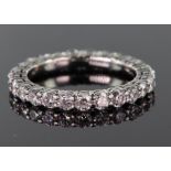 Tests as 18ct white gold diamond full eternity ring set with twenty five round brilliant cut