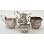 Four Victorian silver milk jugs, hallmarked London 1883, 1884 ( x 2) & 1887, tallest 9.5cm