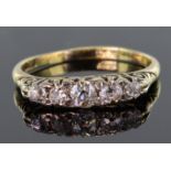 18ct yellow gold carved head ring set with five graduating round old cut diamonds, calculated as