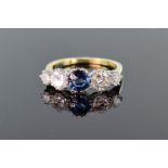 18ct yellow gold and platinum graduated five stone ring set with central round sapphire measuring
