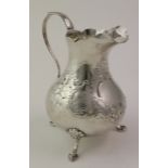 Victorian silver cream jug, has a small split and repair at the top of the handle and the spout is a