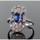 Platinum sapphire and diamond Art Deco style elongated oval ring comprising central oval blue