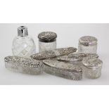 Eight silver topped glass jars, pots etc., silver weight (sold as seen)