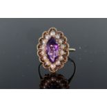 9ct yellow gold ring set with central marquise shaped amethyst measuring approx. 19mm x 7mm,