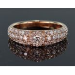 18ct rose gold pave set band ring with a total diamond weight calculated as weighing approx. 0.75ct,