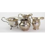 Four George V silver milk & cream jugs, hallmarked London 1913 (x 2) & 1917 (x 2), tallest 7.5cm