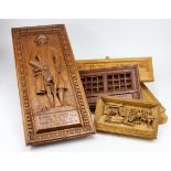 Six hand carved wooden plaques, depicting interesting characters in history, each with a motto,