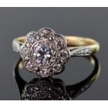 18ct yellow gold and platinum diamond daisy cluster ring consisting of central round brilliant cut