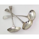 Three George III silver old English pattern sauce ladles (including a matching pair), each with