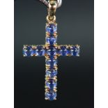 9ct yellow gold cross pendant set with eleven 4mm round cabochon sapphires totalling 3.609ct, weight