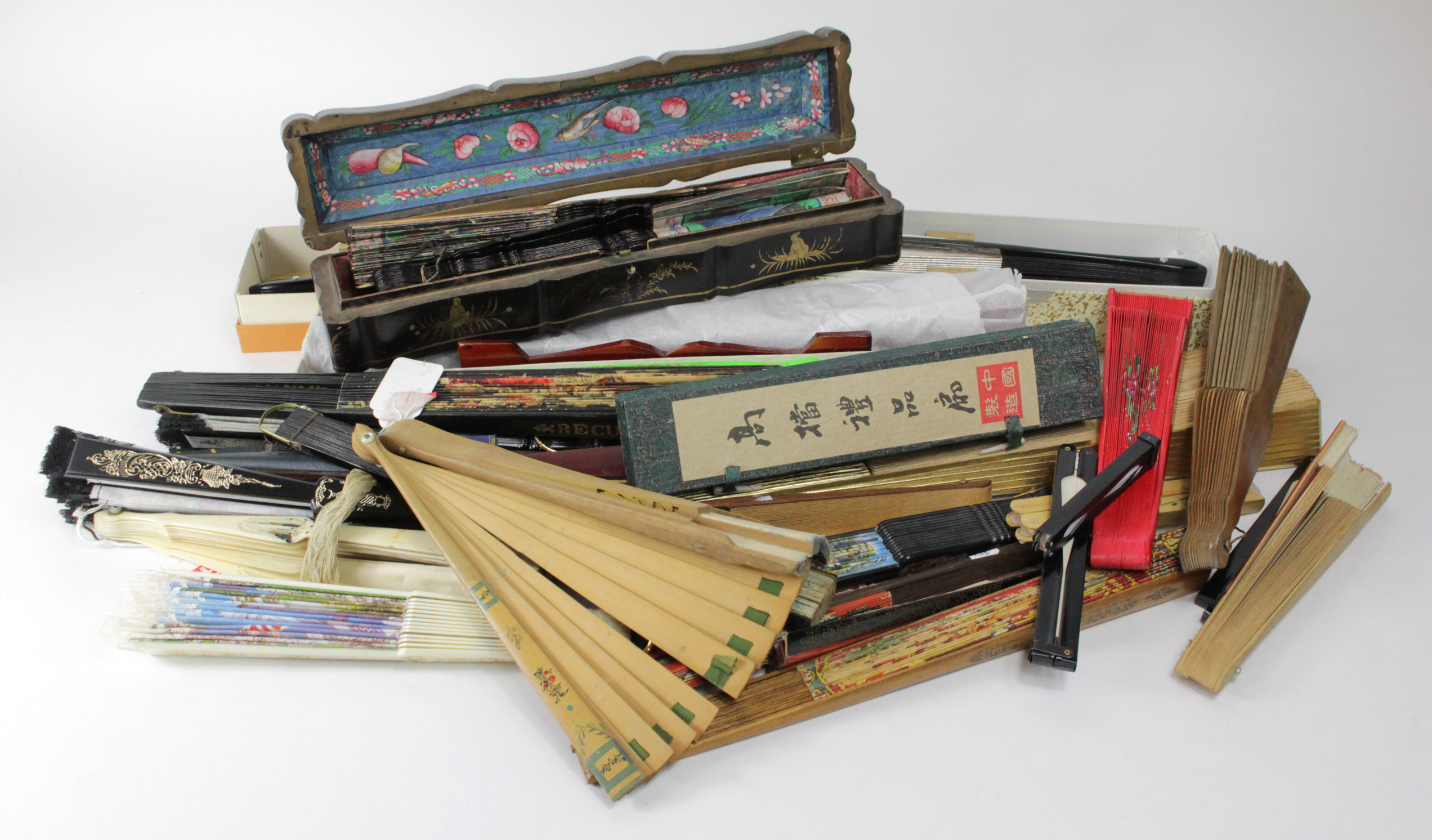 Fans. A collection of over thirty fans, circa early 20th Century & later, including paper, cloth &