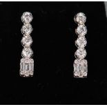18ct white gold diamond drop earrings consisting of four round brilliant cut diamonds with a