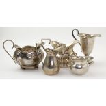 Five George V silver milk & cream jugs, hallmarked Birmingham 1906, 1907, 1909 (x 2) & 1910, tallest